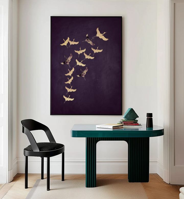 Purple Flying Cranes By Aureous Wildlife Art Prints in Black Plain Frame placed on a Cream Colored Wall near a Table in a Workspace in the Drawing Room