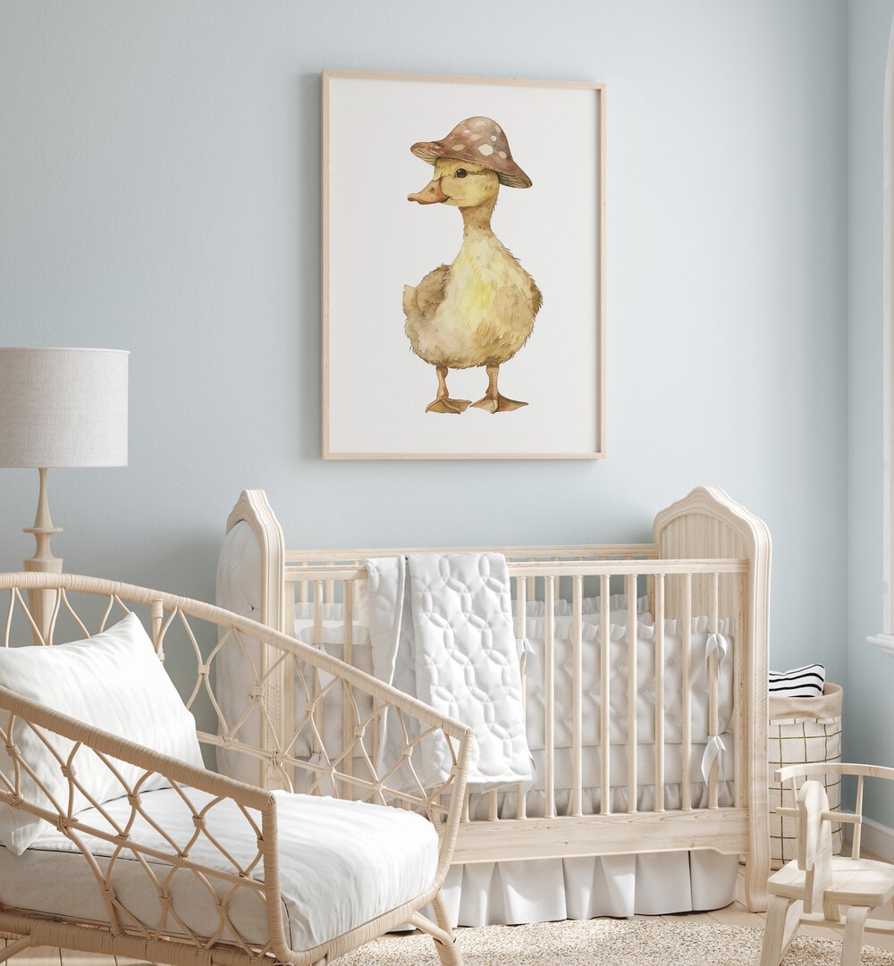 Quacker In A Hat Kids Room Paintings Kids Room Wall Art in Oak Wood Plain Frame placed on a wall in a kids room behind an infant's bed