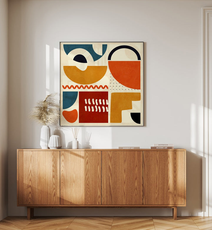 Quadrate Bunt I By Ana Rut Bre Abstract Art Abstract Paintings in Black Plain Frame placed on a Cream Colored Wall above a Console Table in the Drawing Room