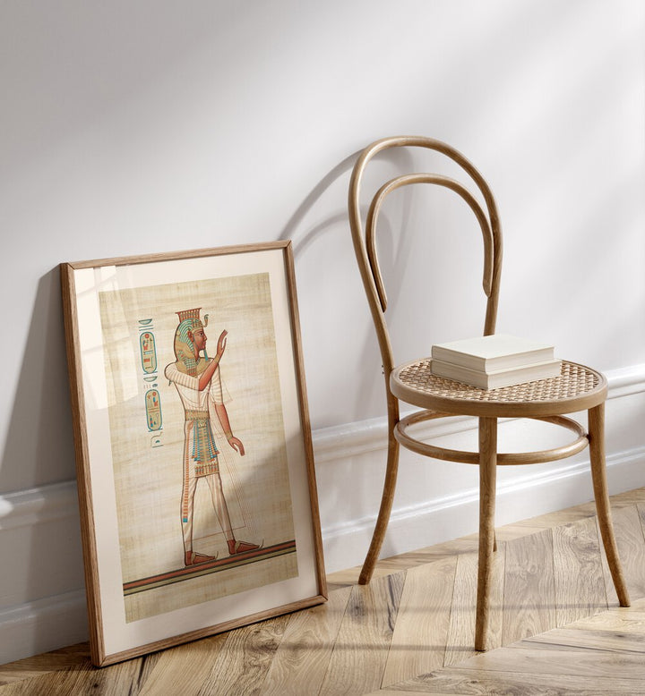 Ramses III Egyptian Art Artwork in oakwood frame with mount beside wooden chair