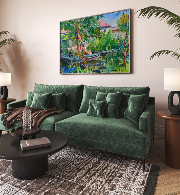 Vibrant RIVER VILLAGE, LANDSCAPE PAINTINGS adorns a cozy living room, enhancing the serene waterside ambiance.