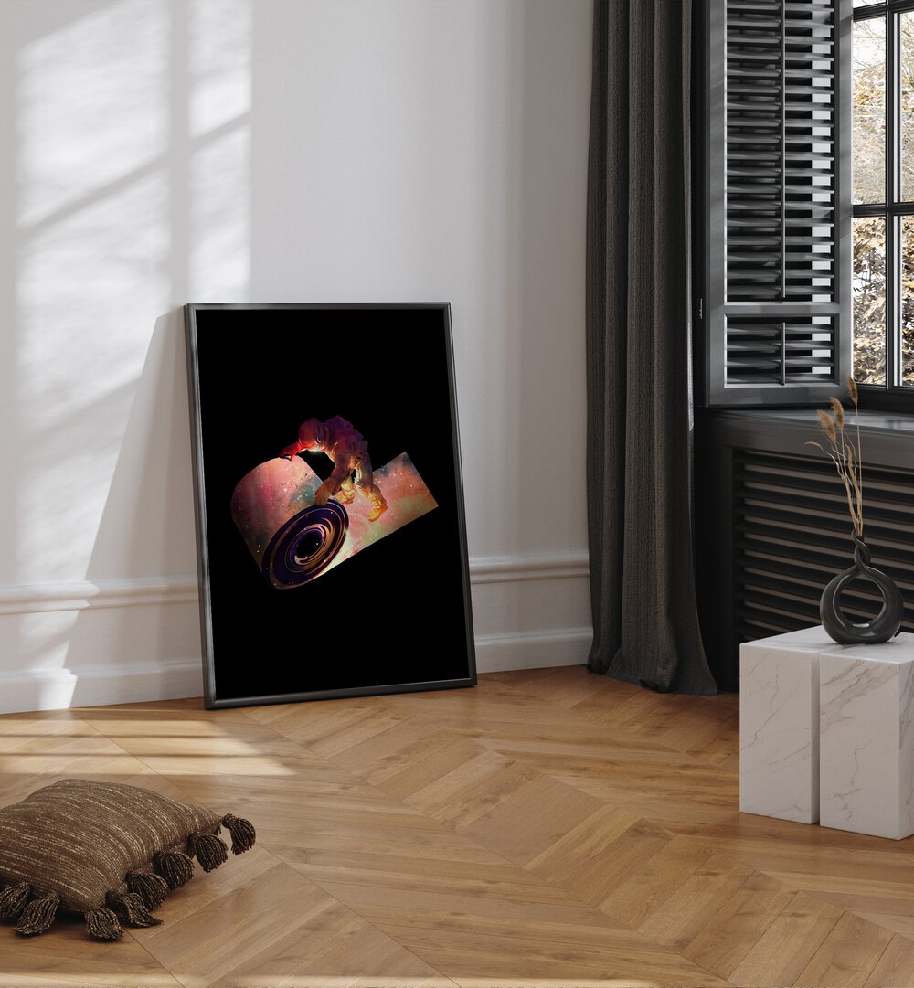 Roll Out By Francis Minoza Astronaut & Nasa Paintings, Space Art Prints Artwork in Black Plain Frame placed on a Wooden Floor near a  White Colored Wall in the Drawing Room
