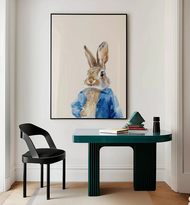 Rabbit In Blue Coat Kids Room Paintings Kids Room Wall Art in Black Plain Frame placed on a wall behind a study table