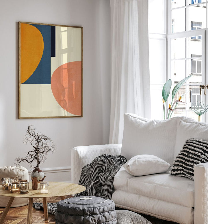 Rainbow Plus Shapes Blue Mustard I By Ana Rut Bre Abstract Art Abstract Wall Art in Oak Wood Plain Frame placed on a wall beside a sofa and a window