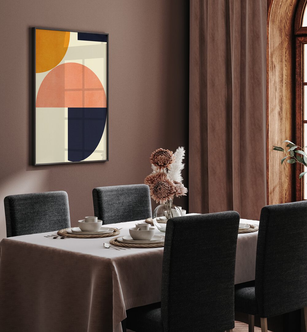 Rainbow Plus Shapes Blue Mustard II By Ana Rut Bre Abstract Art Abstract Wall Art in Black Plain Frame placed on a wall behind a dining table 