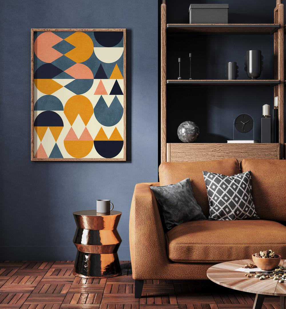 Rainbow Plus Shapes Blue Mustard vi By Ana Rut Bre Abstract Art Abstract Wall Art in Oak Wood Plain Frame placed on a wall beside a sofa