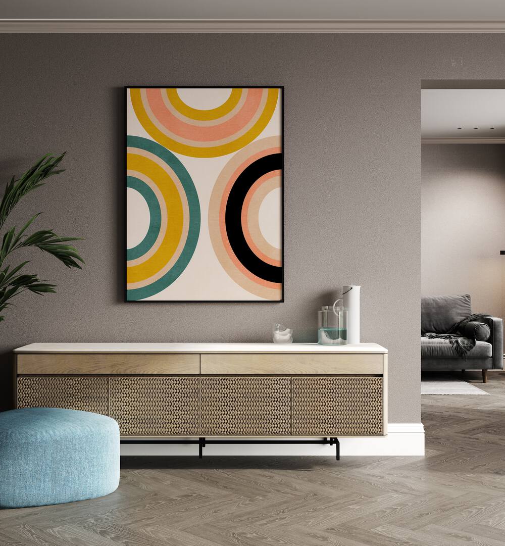 Rainbow Suns xi By Ana Rut Bre Abstract Art Abstract Wall Art in Black Plain Frame placed on a wall behind a console table