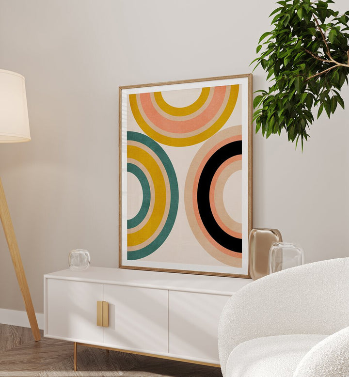 Rainbow Suns xi By Ana Rut Bre Abstract Art Abstract Wall Art in Oak Wood Frame With Mount placed a console table