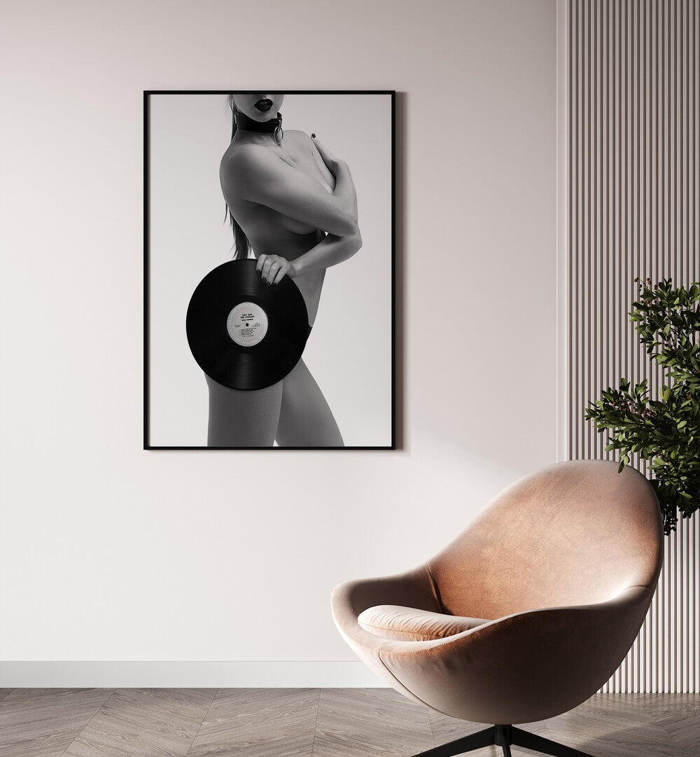 Raw Power Aye Oh Let by David Drake Fine Art Photography Fashion Photography in Black Plain Frame placed on a wall beside a char