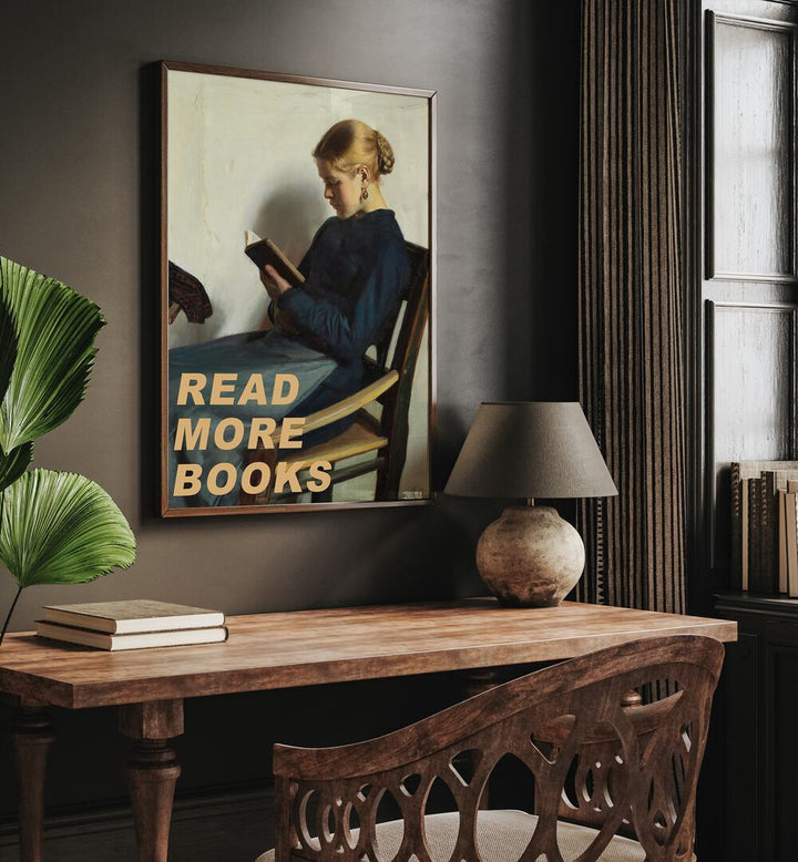 Read More Books by the Art Concept Altered Art Prints in Dark Wood Plain Frame placed on a wall above a study table