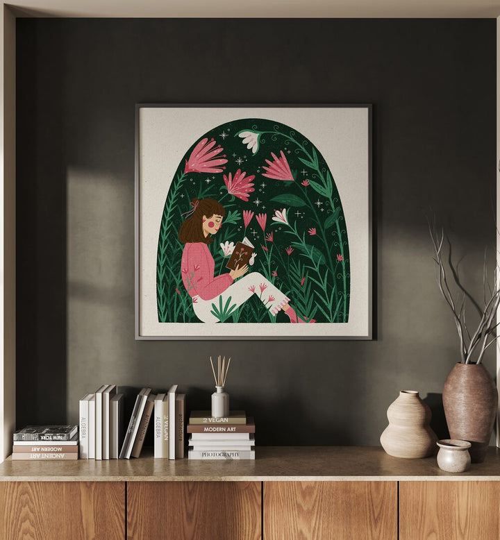 Reading In A Dome Of Plants By Julia Leister Women Illustration Paintings in Black Plain Frame on a wall placed above a table