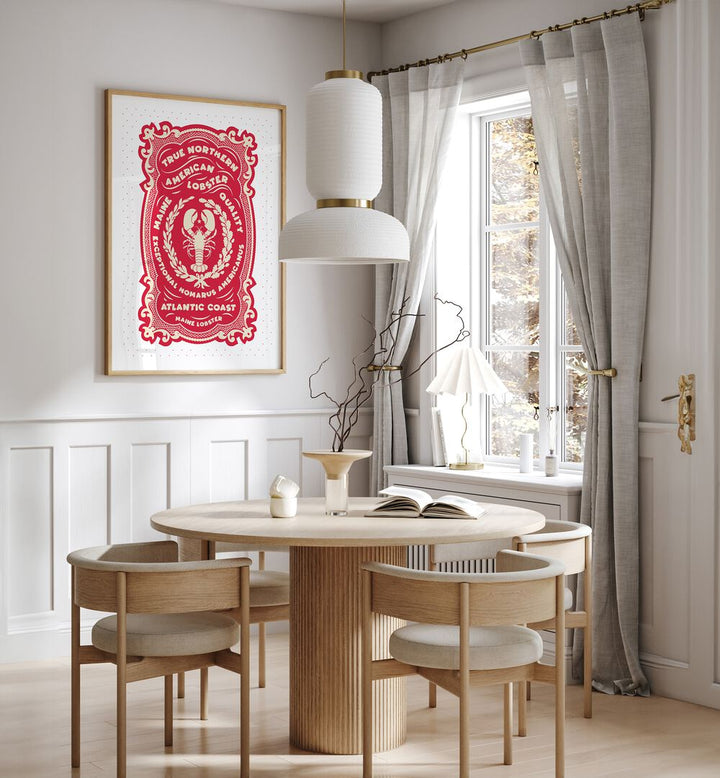 Red Lobster Print by Studio Mandariini Kitchen Posters Kitchen Art Prints in Oak Wood Plain Frame placed on a wall in a dining room area beside a window and behind a dining table