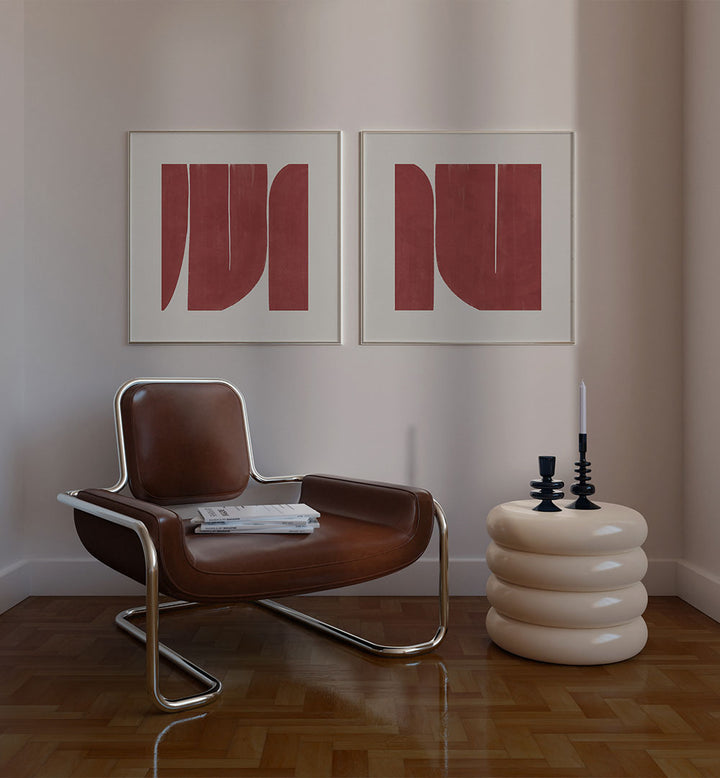Modern interior with a brown chair, white table, and abstract red art on the wall.