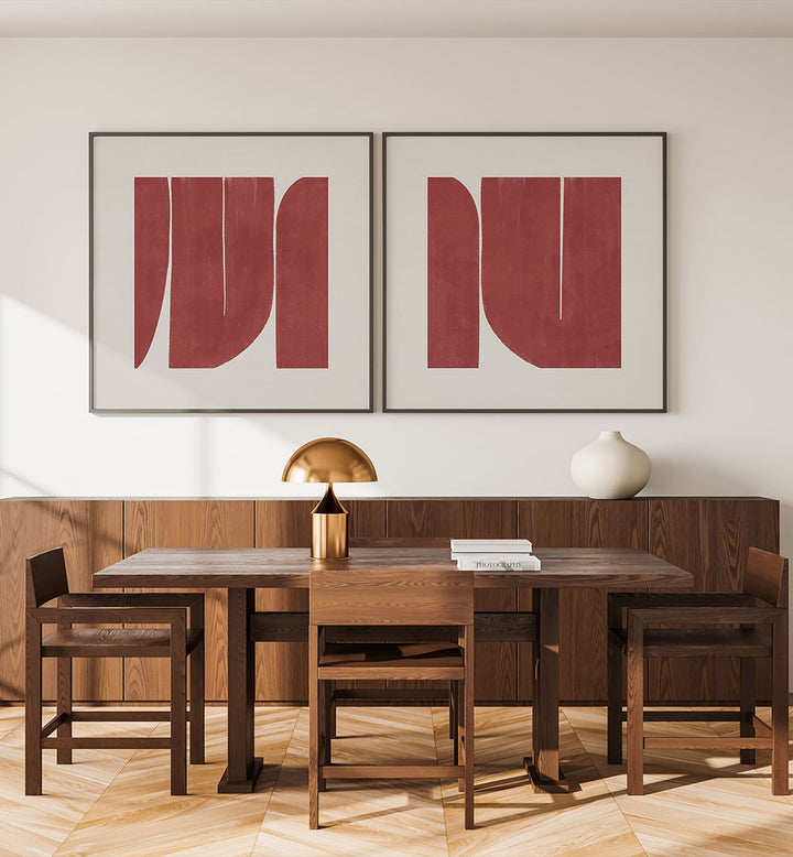 Dining room with wooden table and chairs, gold lamp, and abstract red art on the wall.