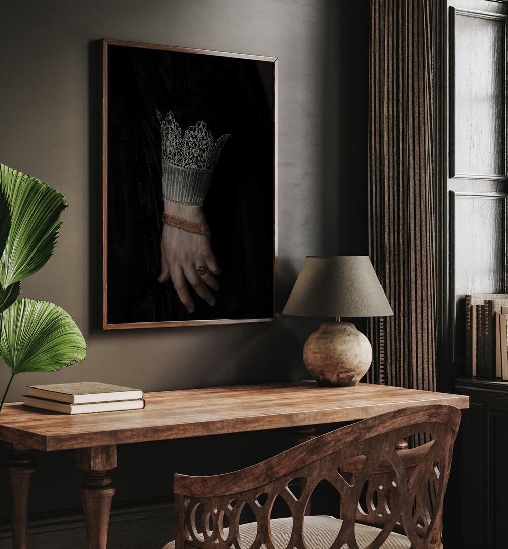 Regal Grasp The Royal Gothic Hand Gothic Art Prints in Oak Wood Plain Frame hanging on wall above study table beside a window.