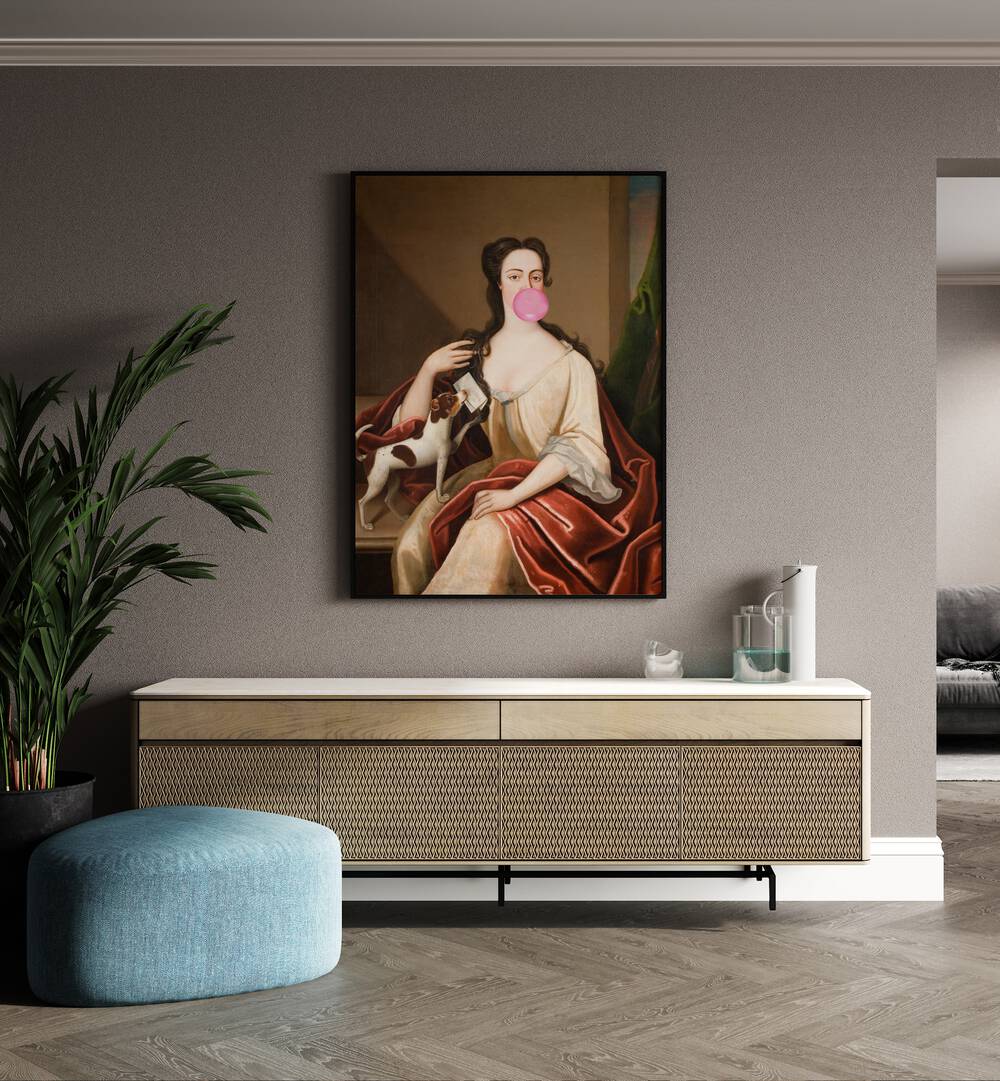 Renaissance Bubble Gum Portrait and Dog by the Art Concept Altered Art Prints in Black Plain Frame placed on a wall behind a console table