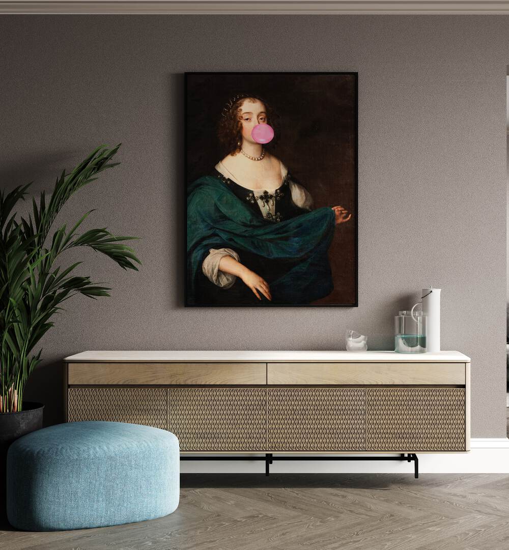 Renaissance Bubble Gum by the Art Concept Altered Art Prints in Black Plain Frame placed on a wall behind a console table