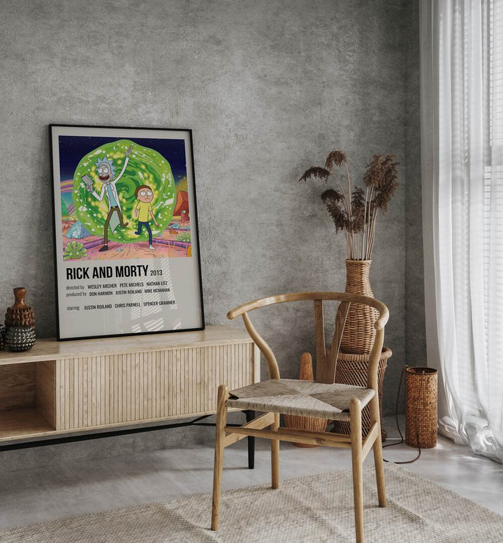 Rick Morty 2013 i Movie Posters in Black Plain Frame placed on a table beside oakwood chair