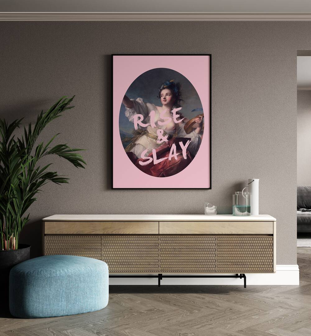 Rise and Slay By Grace Digital Art Co Altered Art Prints in Black Plain Frame placed on a wall behind a console table