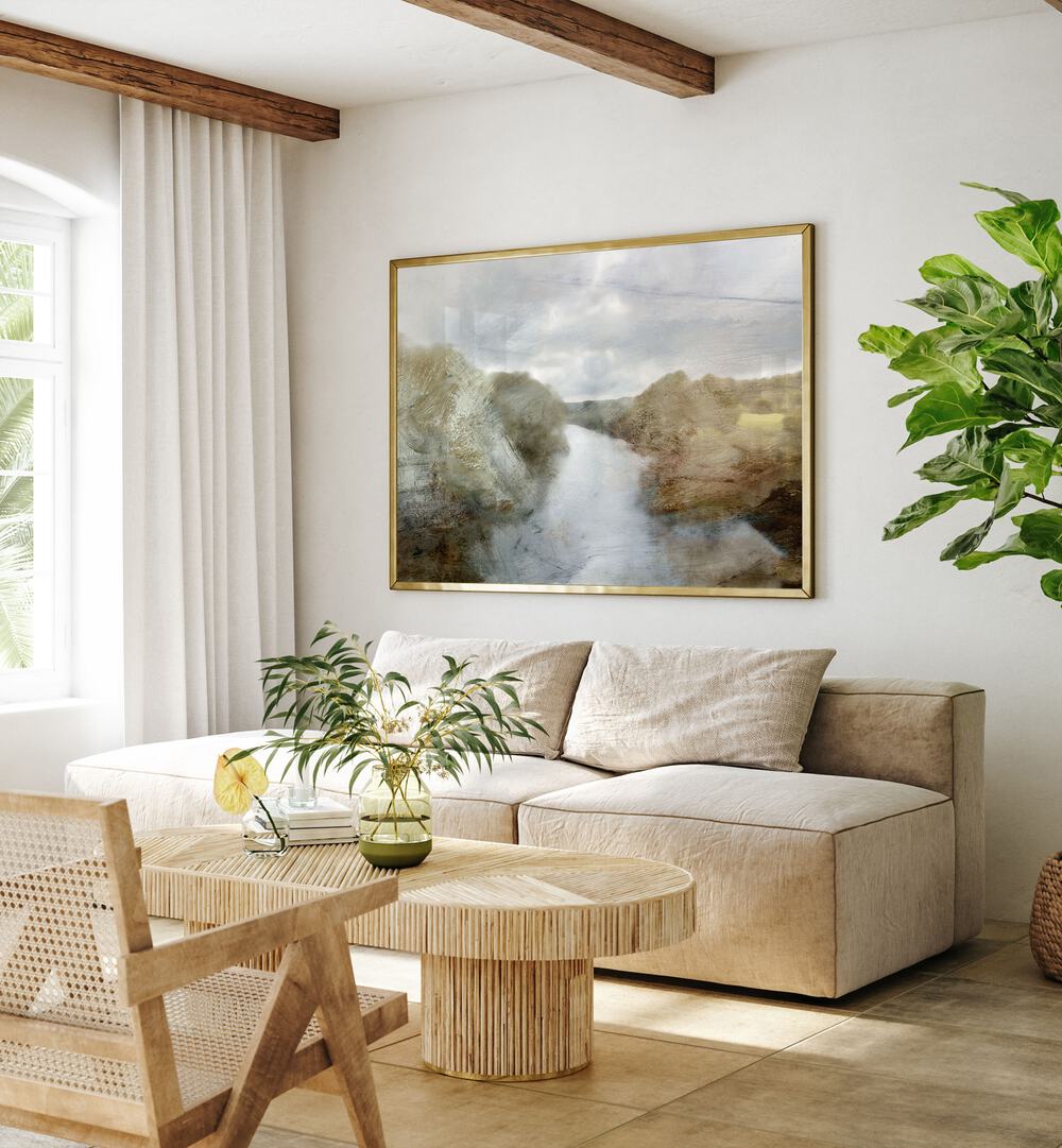 River By Dan Hobday Landscape Art Prints Landscape Paintings in Gold Plain Frame placed on a Cream Colored Wall near a Beige Sofa in the Living Room