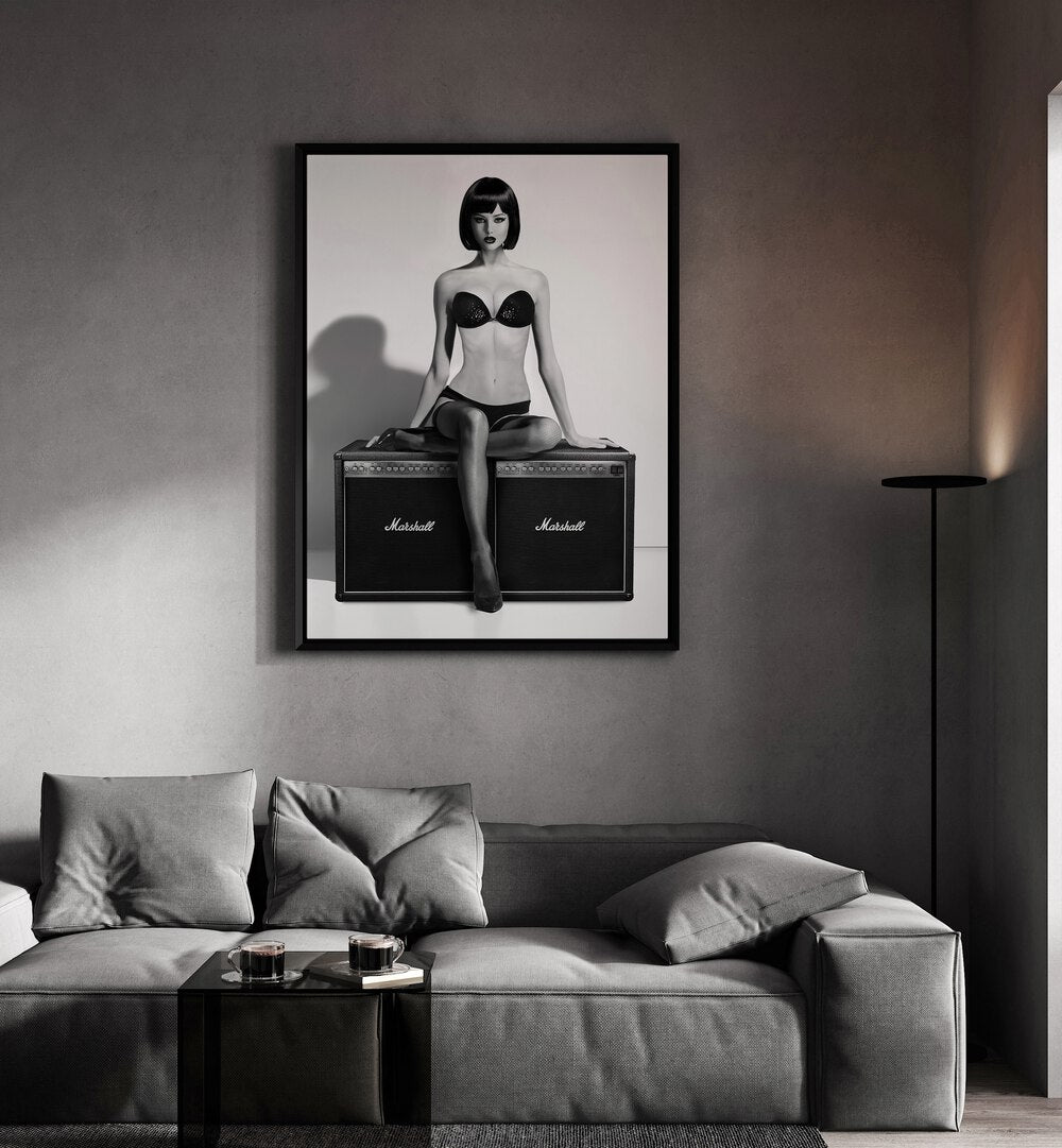 Rock This by David Drake Fine Art Photography Fashion Photography in Black Plain Frame placed on a living room wall behind a grey sofa 