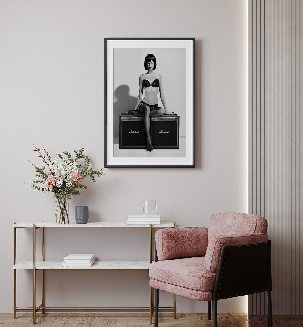 Rock This by David Drake Fine Art Photography Fashion Photography in Black Frame With Mount placed on a wall behind a table 