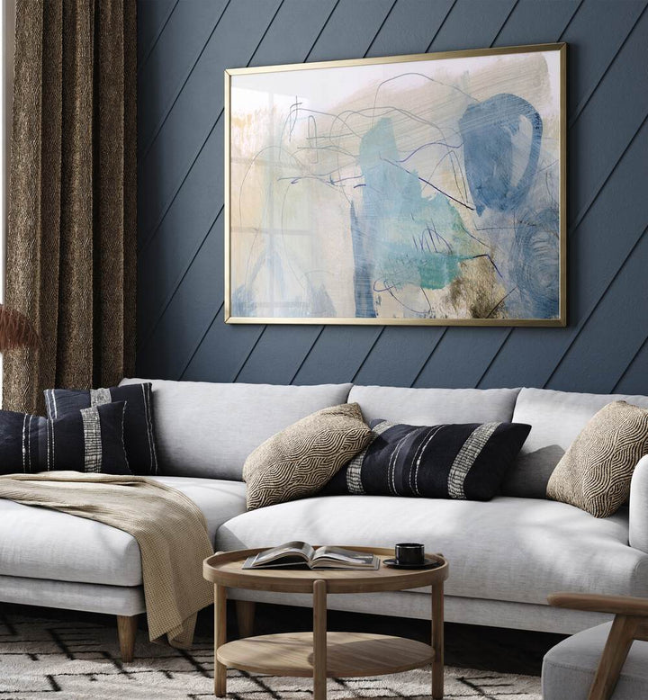 Rockpool By Dan Hobday Abstract Art Abstract Paintings in Gold Plain Frame placed on a Blue Colored Wall near a White Sofa in the Living Room