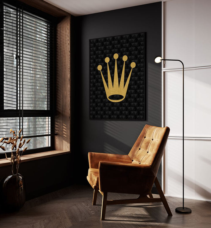 Rolex Crown Fashion Paintings Fashion Posters in Black Plain Frame placed on a Dark Grey Colored Wall near a Brown Sofa Chair in the Drawing Room