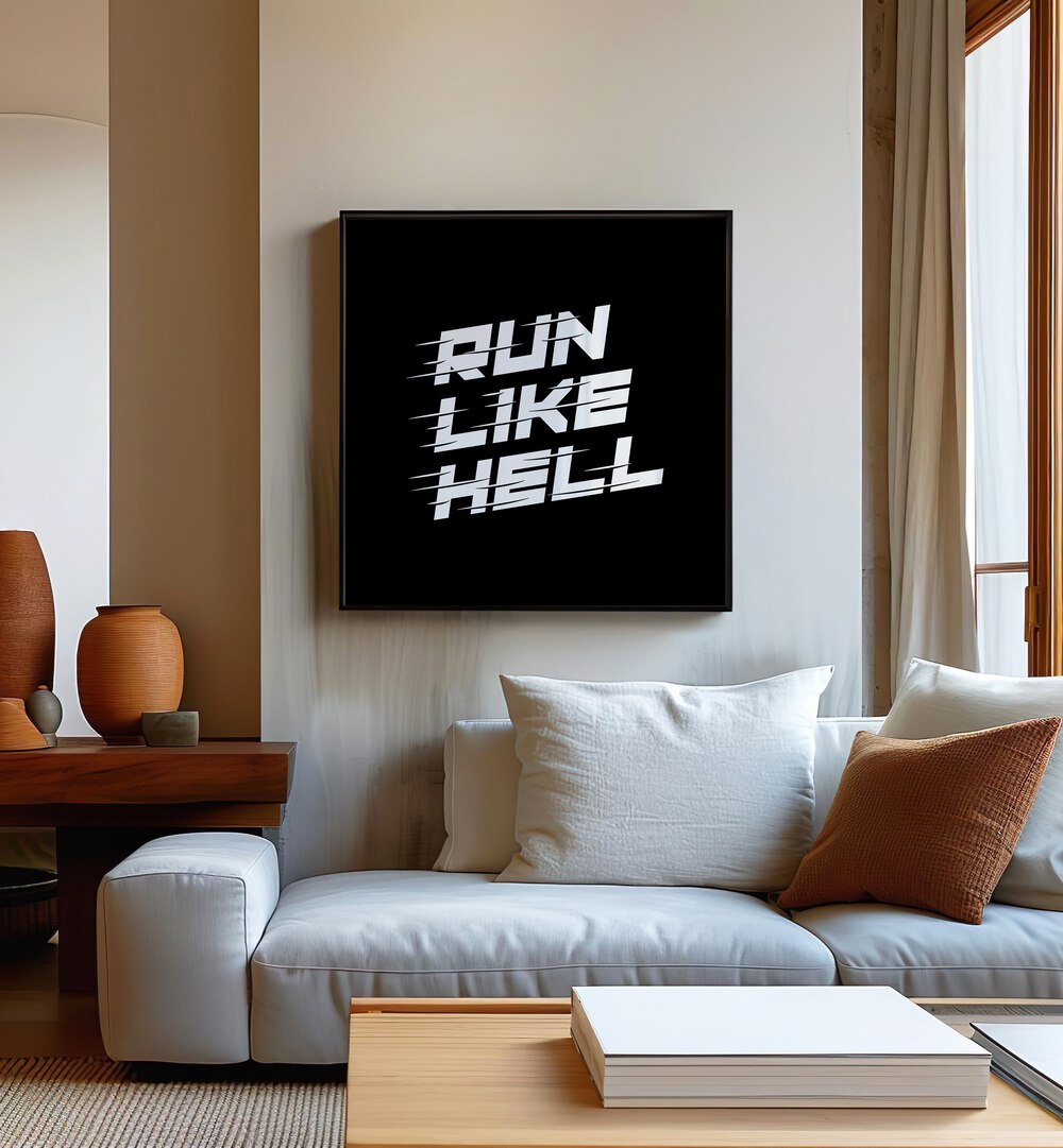 Run Like Hell Quotes and Typography Posters in Black Plain Frame placed on a wall in living room behind a sofa