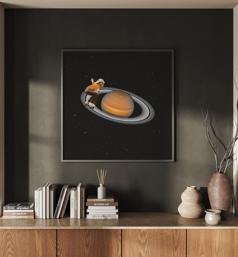 Saturn Skating -Skateboard Surreal Art Painting Artwork in plain black frame above a console table on a grey wall