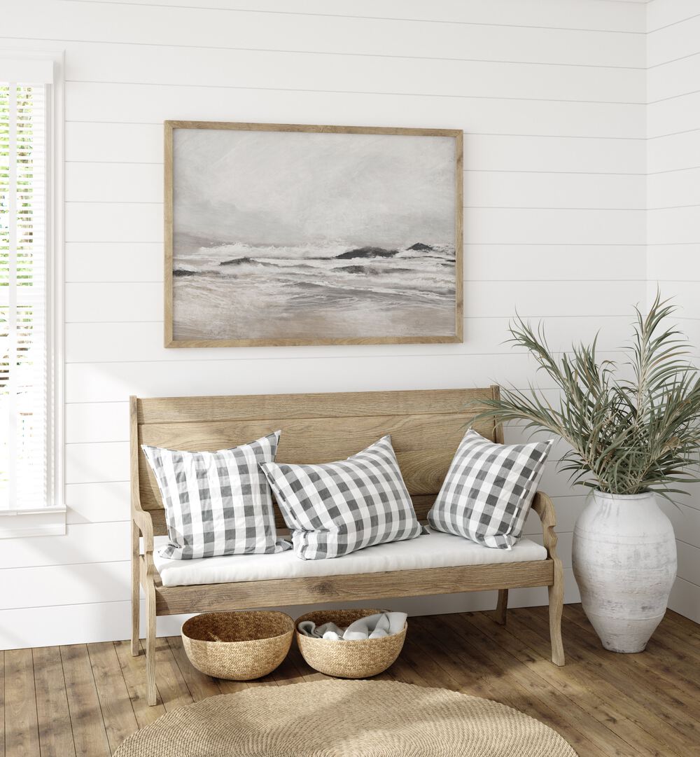 Stylish interior featuring SEPTEMBER COAST, ABSTRACT PAINTINGS above a rustic bench, enhancing coastal charm and elegance.
