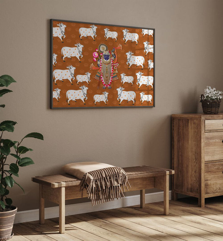 Shrinathji's Grace And Sacred Cow Indian Art Painting Artwork in Black Plain Frame Placed on a Brown wall near wooden furniture in the Living Room