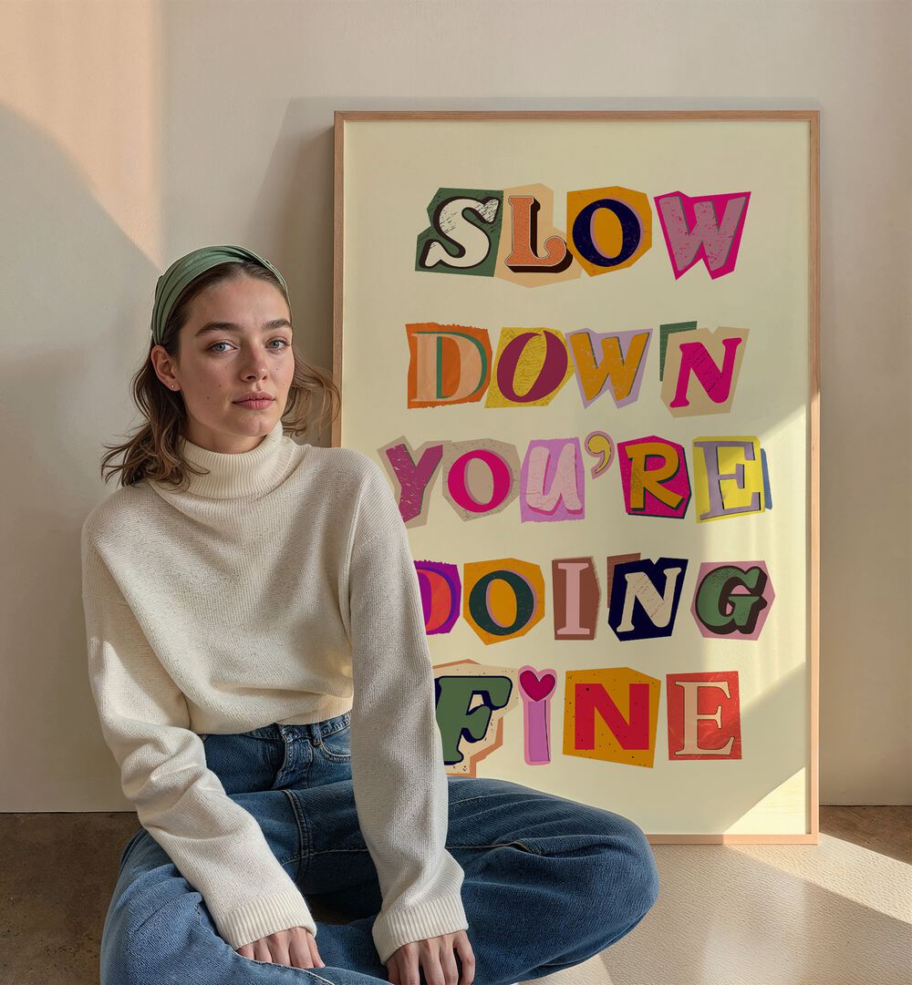 Stylish woman beside the "SLOW DOWN YOU'RE DOING FINE" art print, perfect for adding positivity to any space.