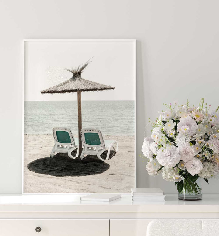 Transform your space with SOLARIS II, BEACH PAINTINGS, featuring serene beach chairs under a straw umbrella.