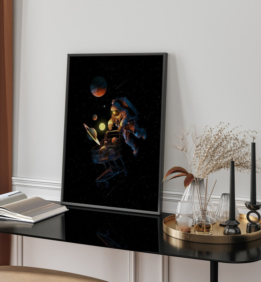 Space Cart Print By Francis Minoza Astronaut & Nasa Paintings, Space Art Prints Artwork in Black Plain Frame Placed on a Table