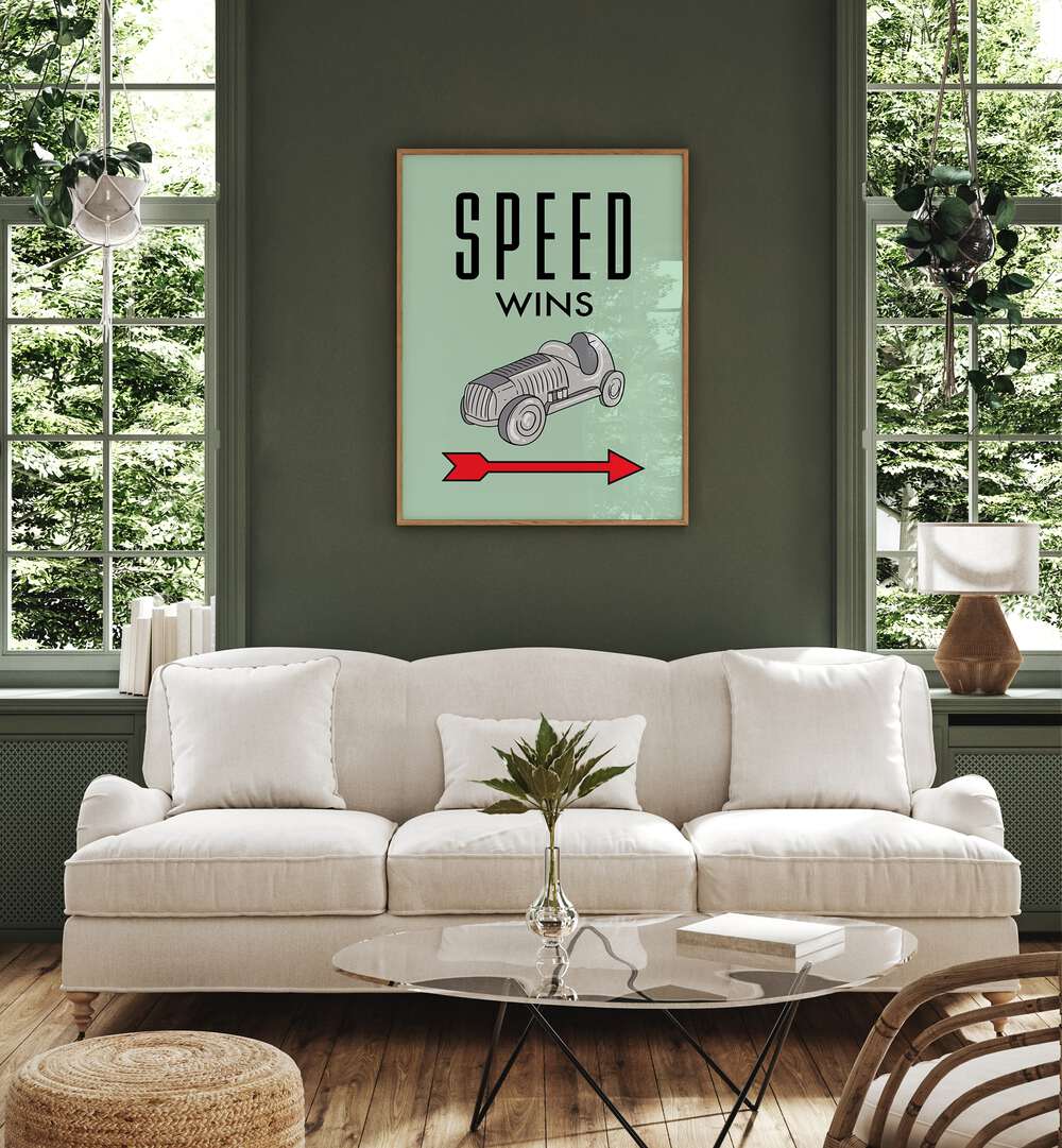 Speed Wins Money Art Artwork in plain oak wood frme hanging on wall above white sofa in living space