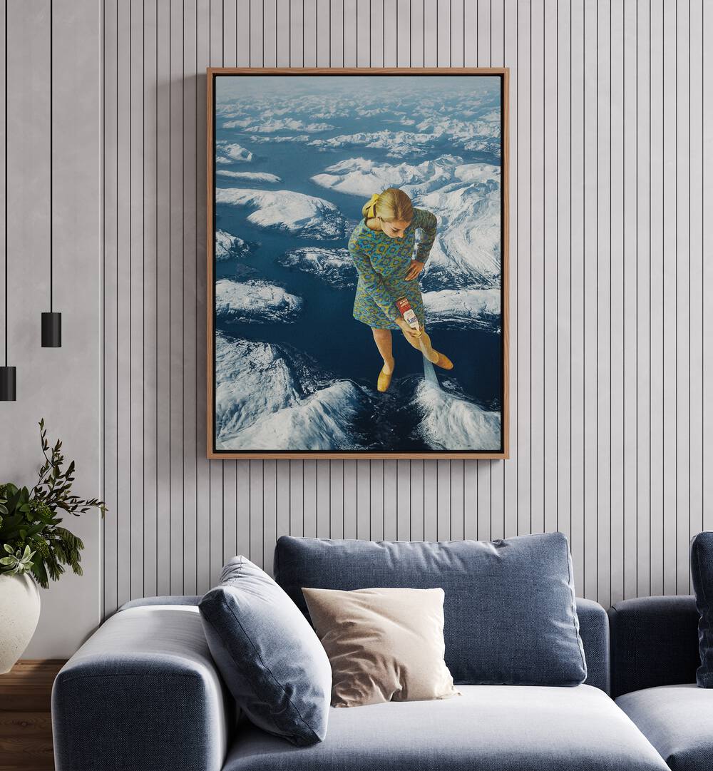 Spraying Snow On The Mountains Surreal Art Painting Artwork in oakwood floater frame behind a sofa on a white wall 