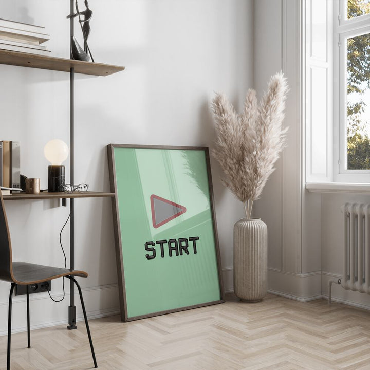 Start Gaming Gaming Art Painting Artwork in dark wood frame next to a flower vase