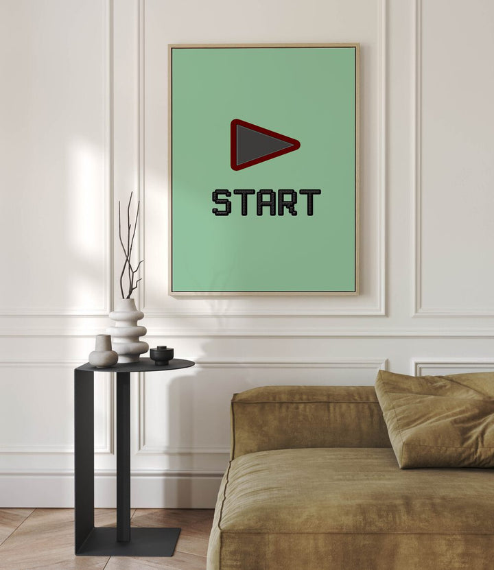 Start Gaming Gaming Art Painting Artwork in oakwood floater frame behind a sofa on a white wall