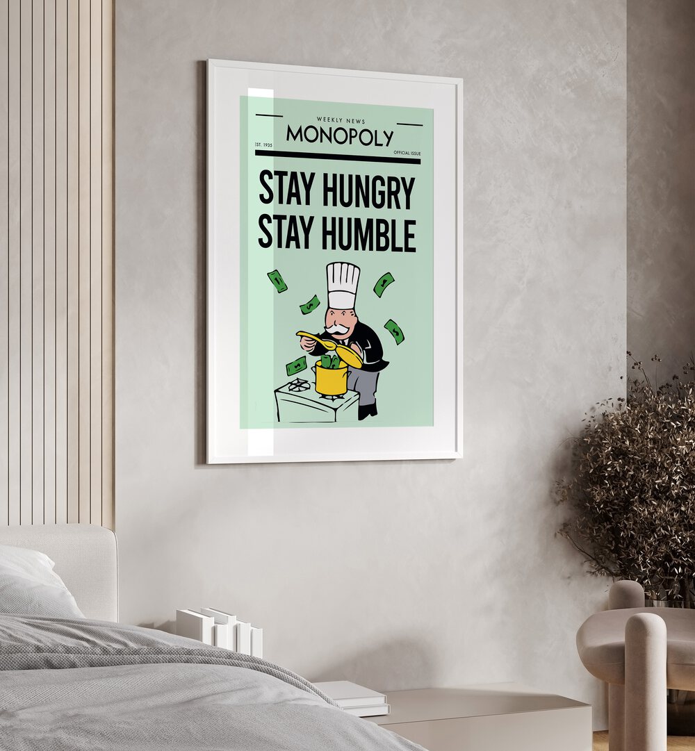 Stay Hungry Stay Humble Money Art Artwork in white frame with mount hanging on wall in bedroom 