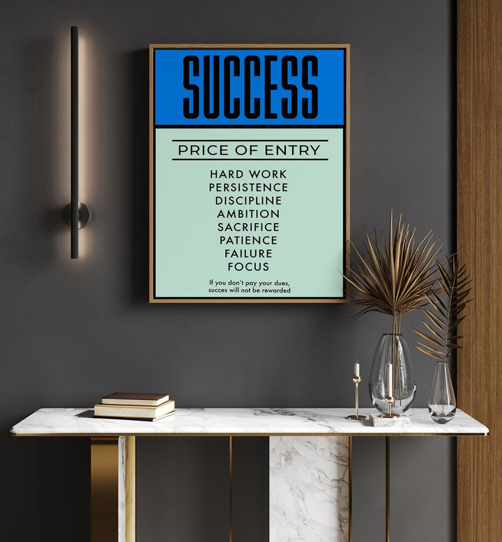 Success Money Art Artwork in plain oakwood frame hanging on wall above console table