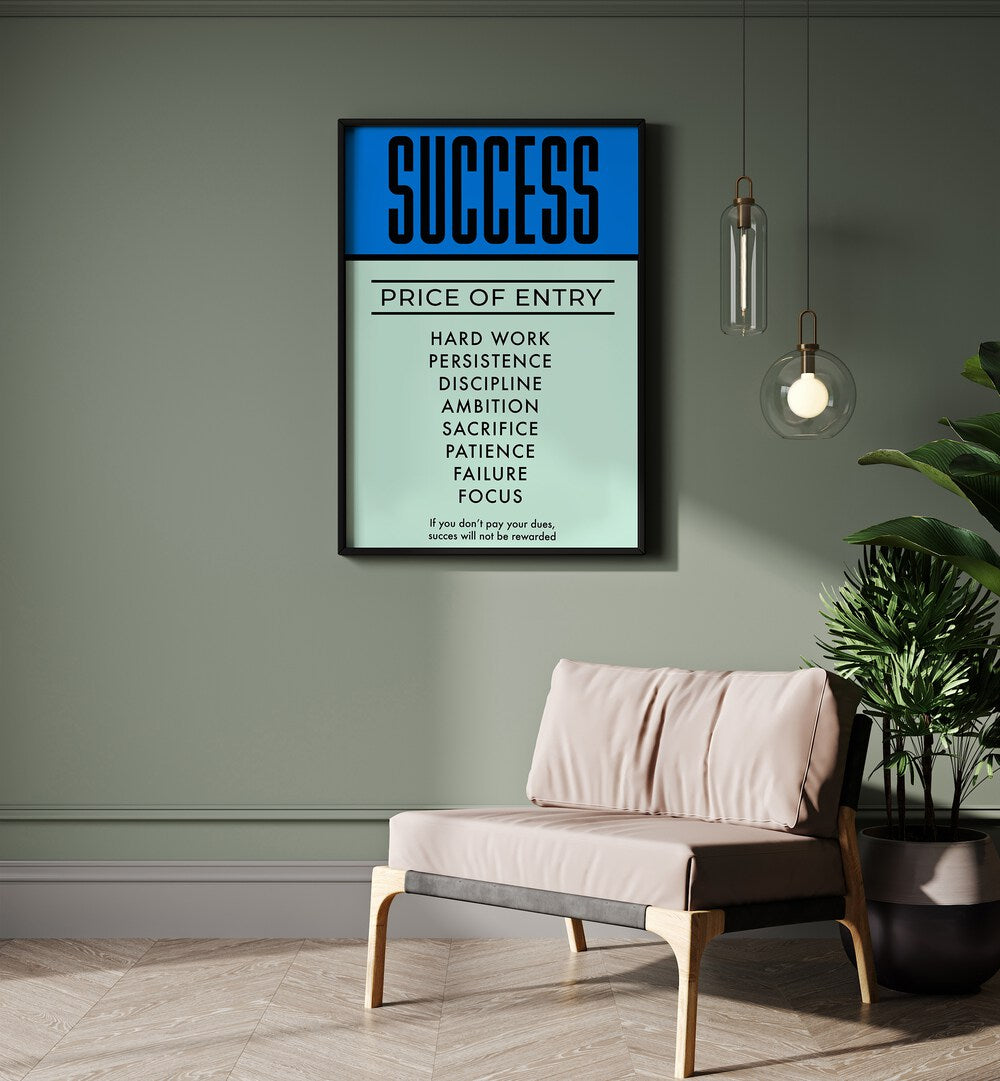 Success Money Art Artwork in plain black frame hanging in wall above brown couch