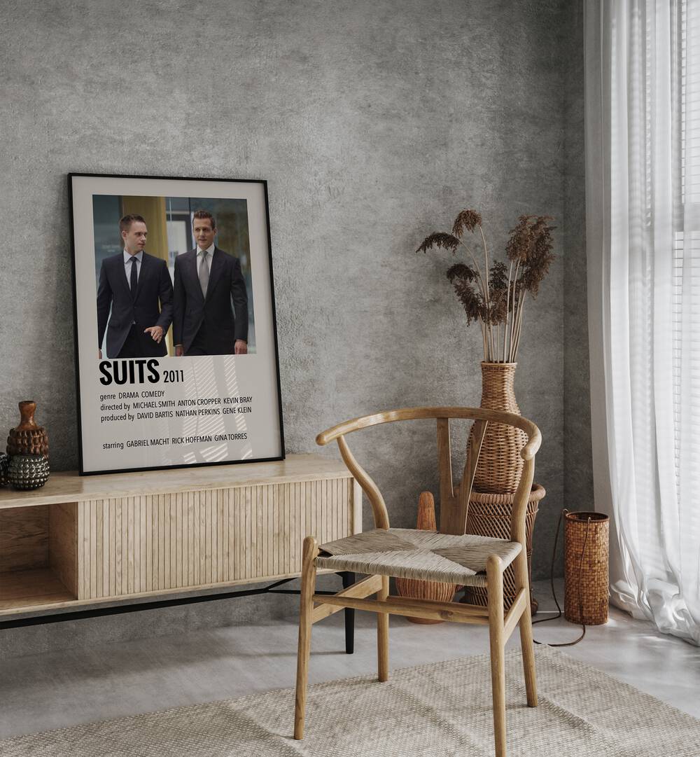 SUITS 2011 MOVIE POSTERS in Black Plain Frame placed on a table beside chair