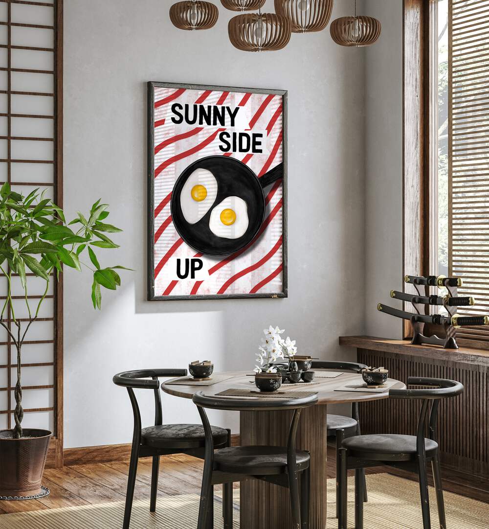 Framed art featuring sunny side up eggs, perfect for enhancing the ambiance at SUNNY SIDE UP, BAR & CAFE.