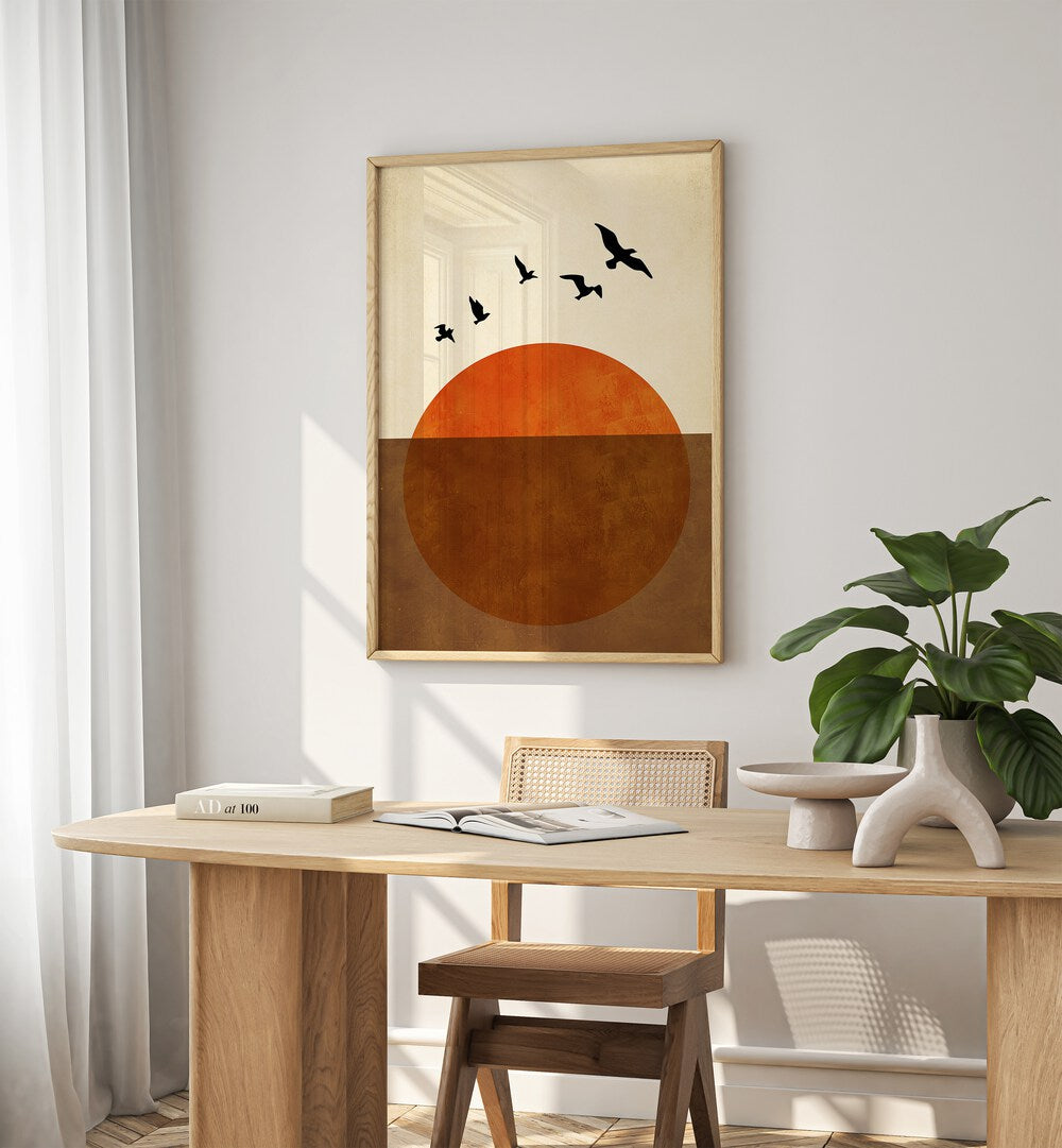 Sunset Dreams Landscape Art Artwork in Oak Wood Plain Frame Placed on a White Wall near a work station