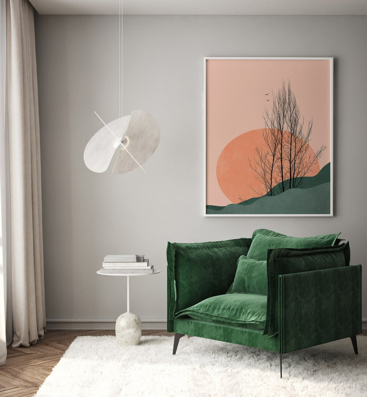 Sunset Memories Landscape Art Artwork in White Plain Frame Placed on a Light Grey Wall Behind A Green Sofa Chair in The Drawing Room