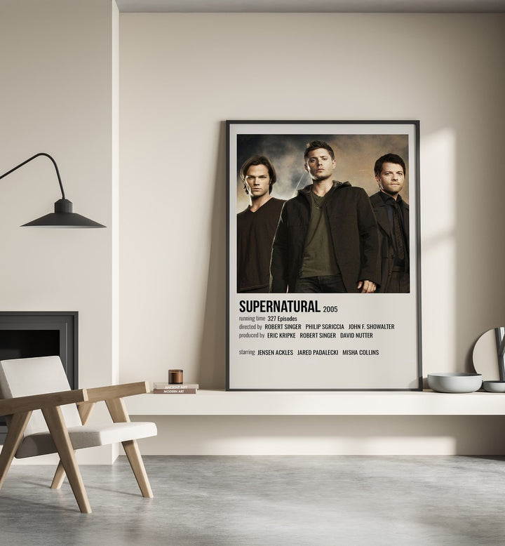 SUPERNATURAL 2005 MOVIE POSTERS in Black Plain Frame placed on wall beside chair and lamp