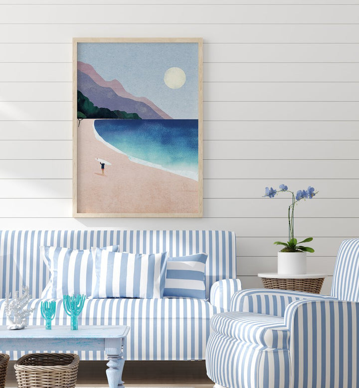 Surf beach Landscape Art Artwork in Oak Wood Plain Frame Placed on a White Striped Wall behind a Blue and White Striped Sofa In the Living Room