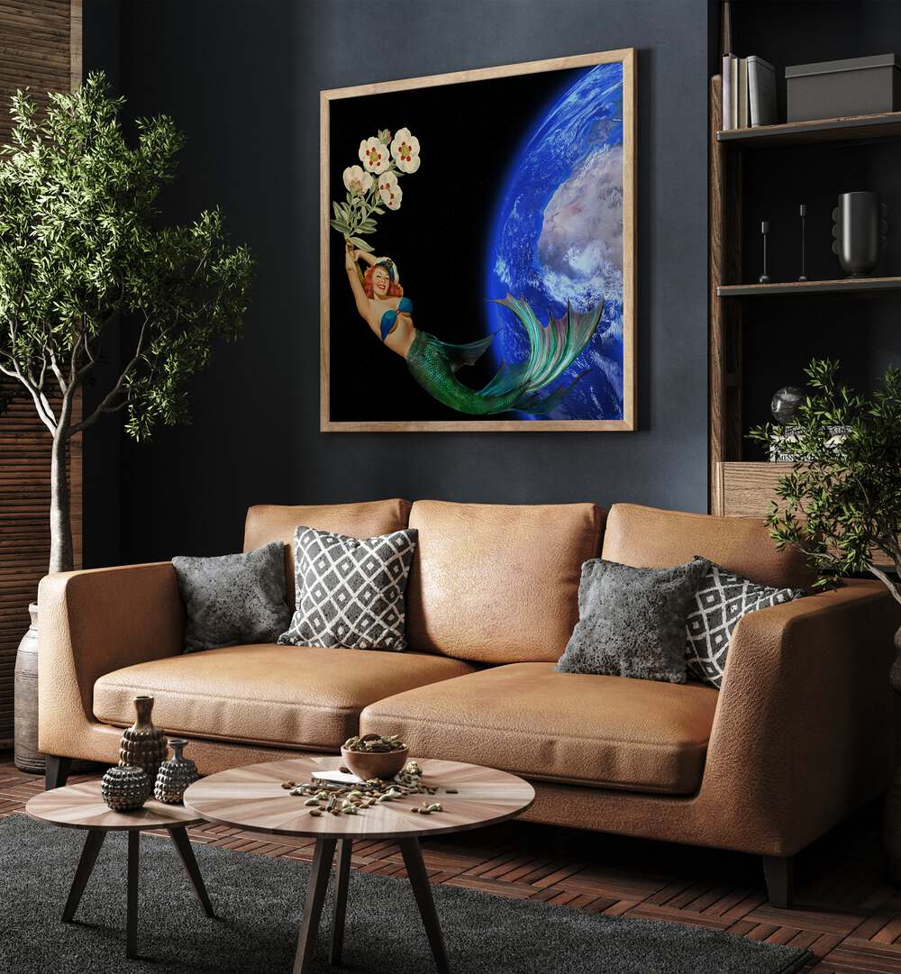 Surreal art prints titled "SWIMMING AWAY," featuring a mermaid against Earth, perfect for stylish decor.