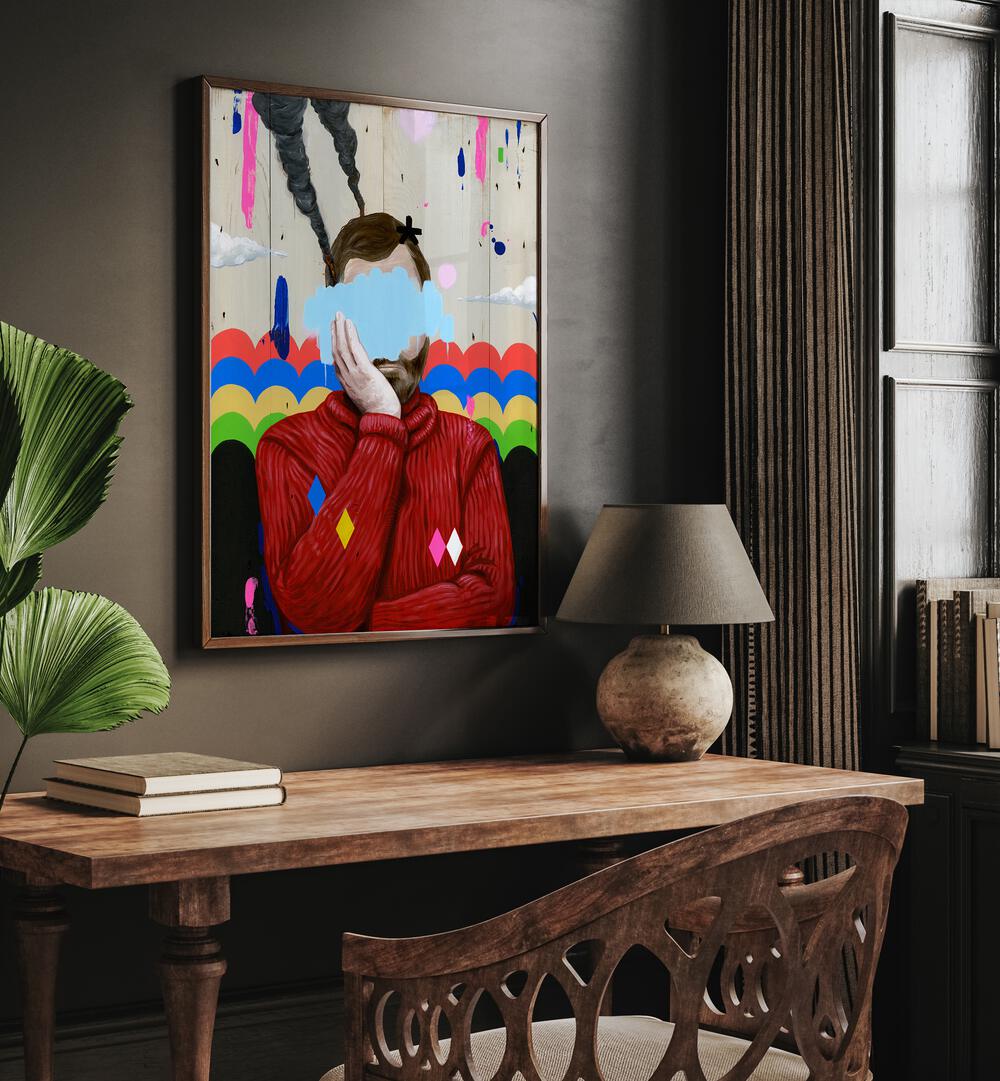 Sad by Famous When Dead Pop Art Paintings Pop Art Prints in Dark Wood Plain Frame on a wall above a study table beside a lamp